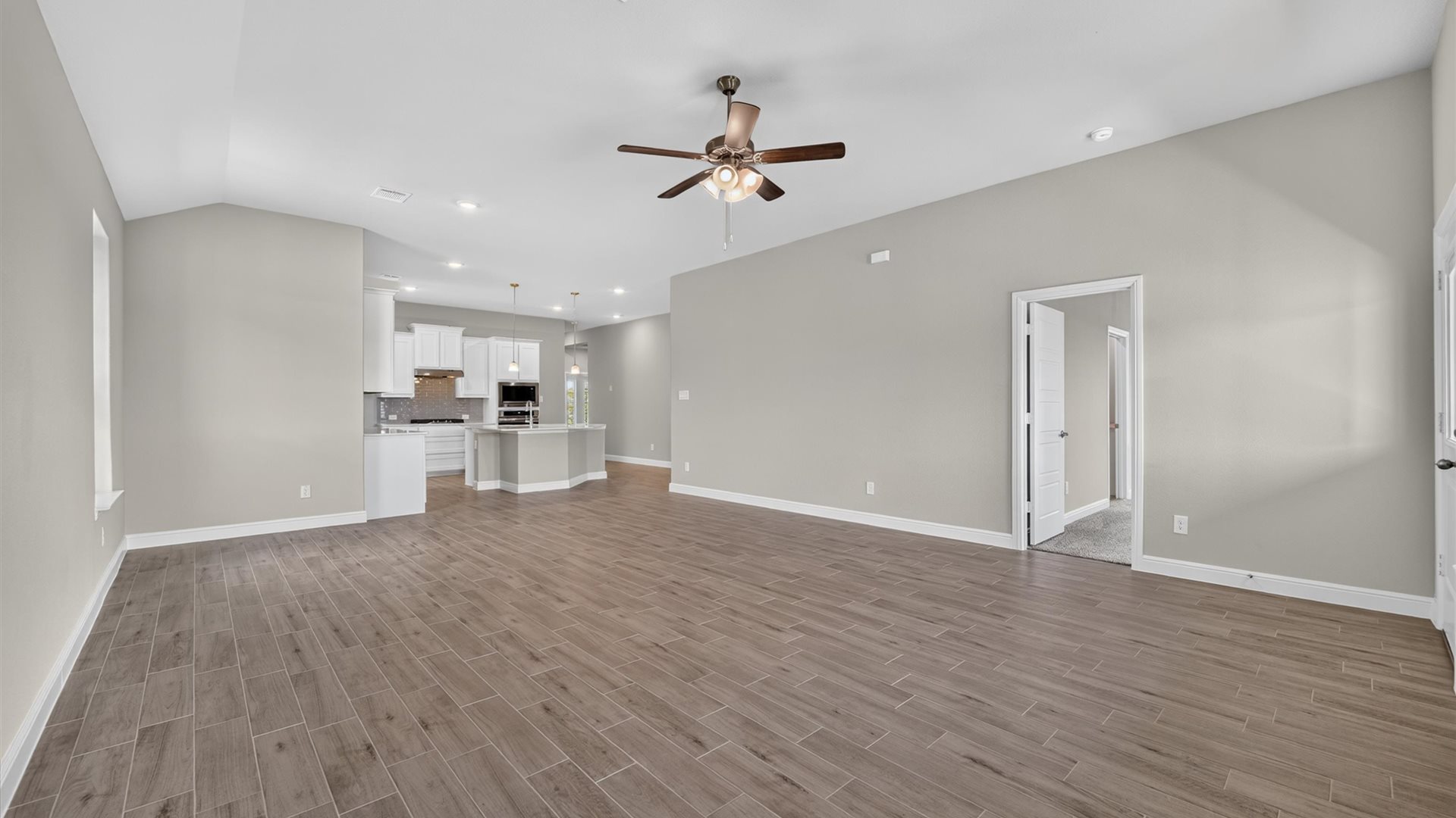 Open concept kitchen, dining, and living area