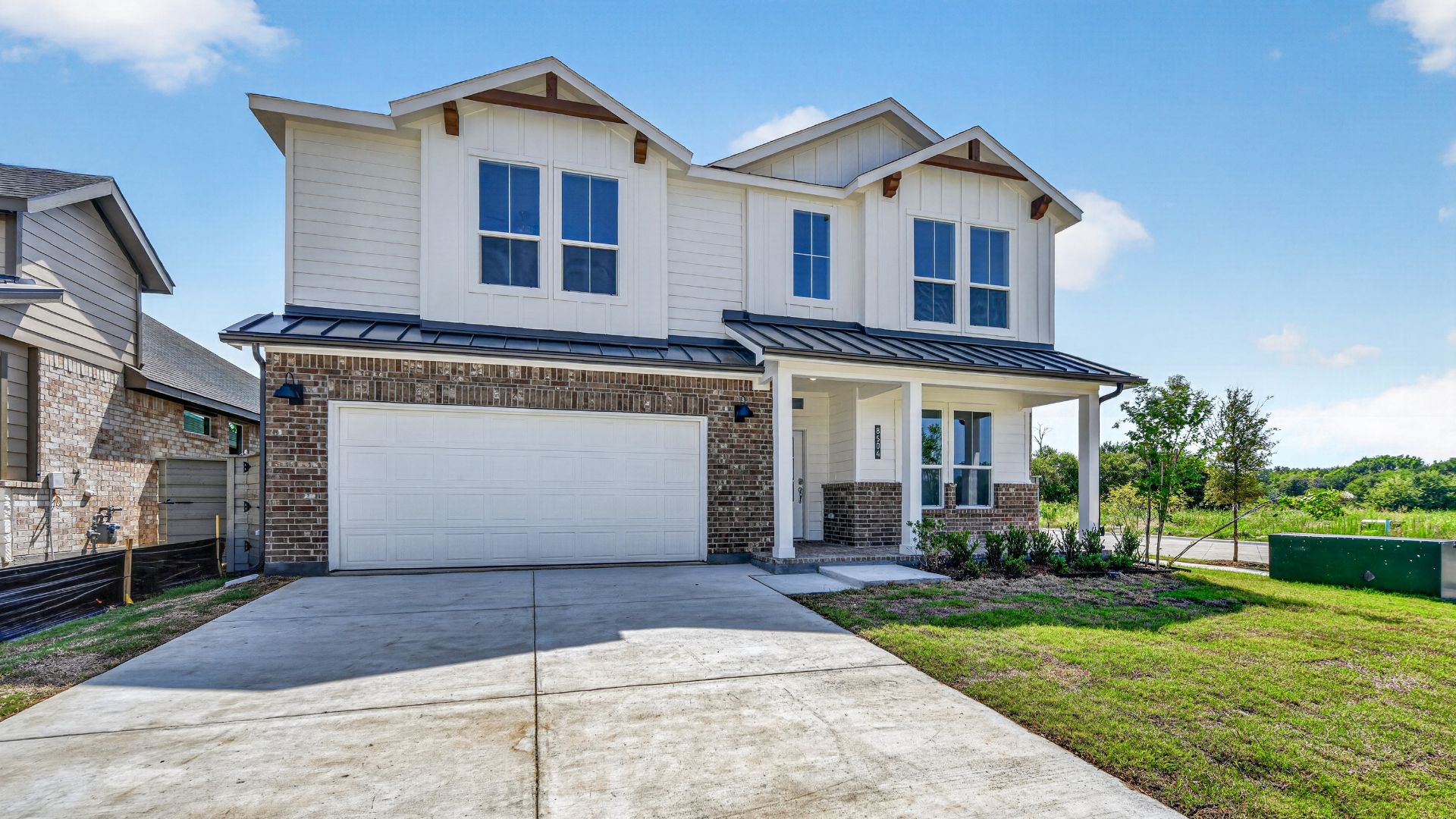 Tallow brick and stone two-story home