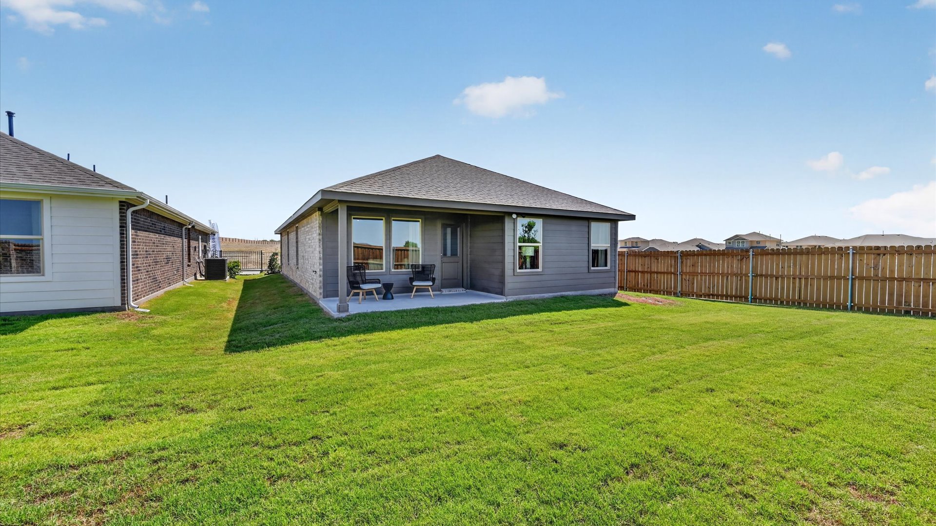 Covered back patio overlooking backyard