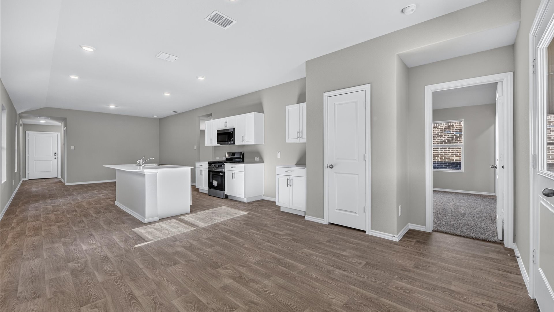 Open concept kitchen, living, and dining