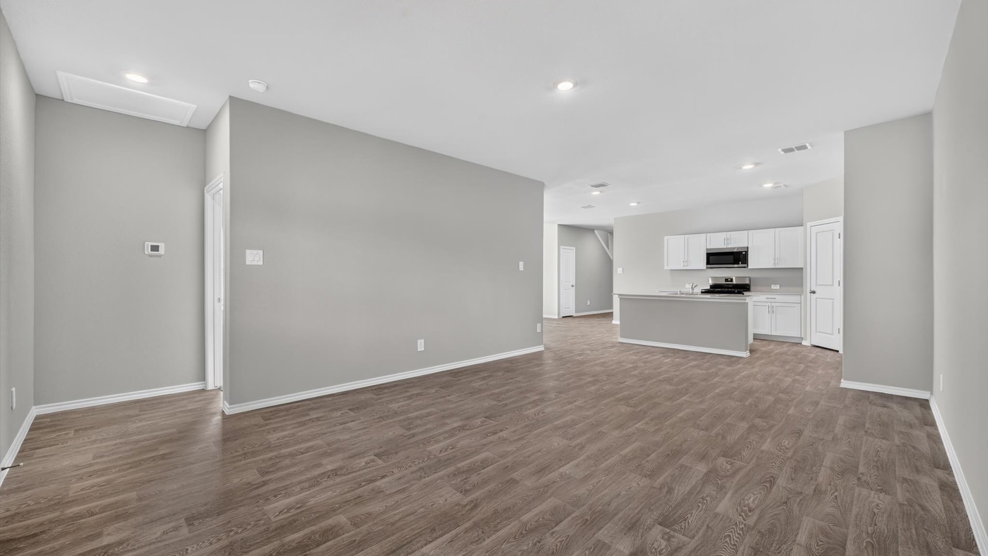 Open concept kitchen, dining, and living