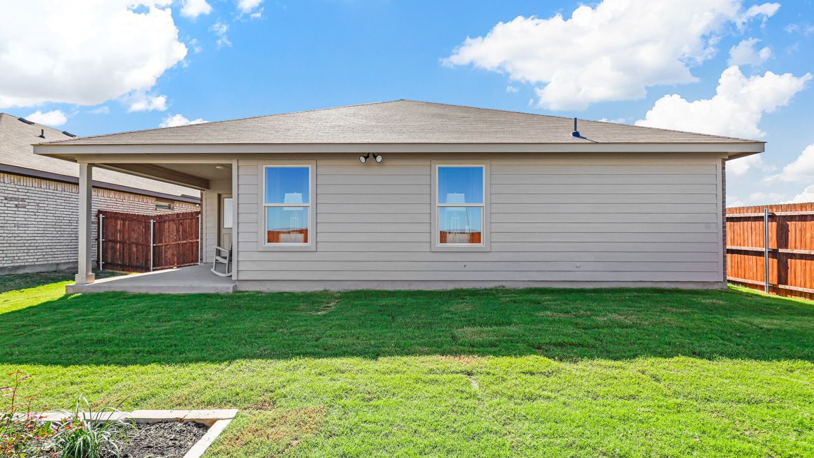 Spacious backyard with covered patio