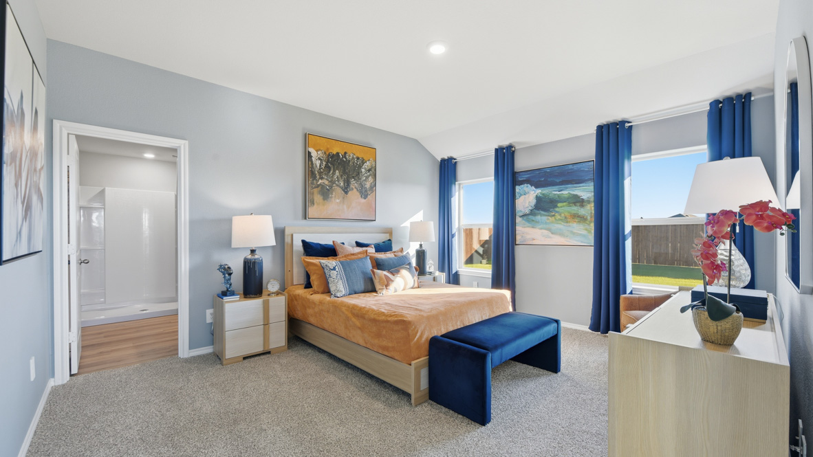 Bedroom 1 with ensuite bathroom and natural lighting