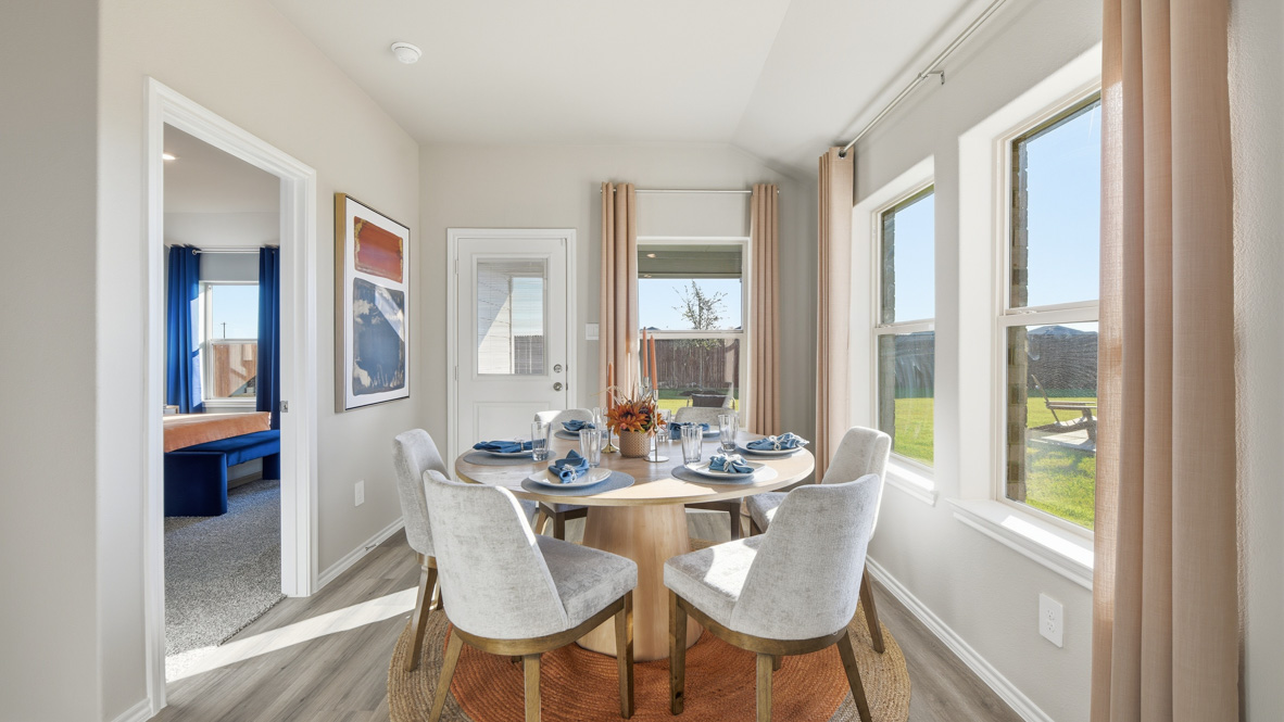 Dining space overlooking backyard