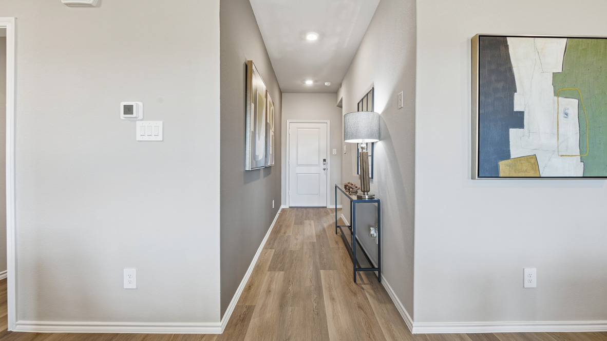 Hallway to front door and secondary bedrooms