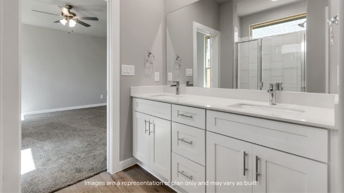 Private attached primary bathroom with built in vanity