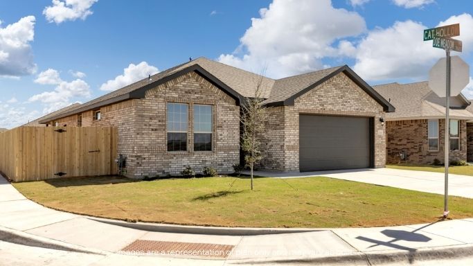 Side view of single story timeless brick home