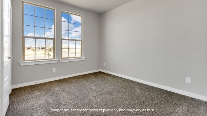 Bedroom with large windows and natural light.