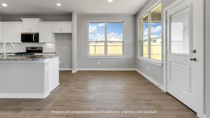 Spacious dining area with large windows and easy outdoor access.