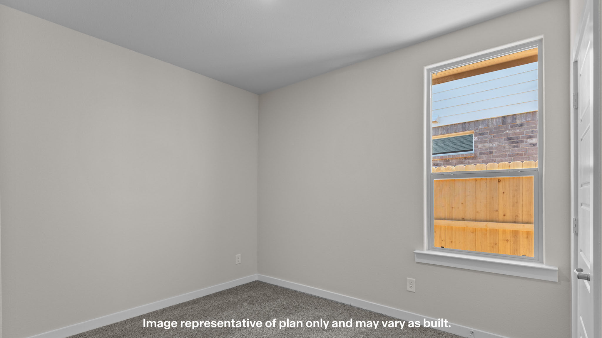 Guest bedroom 2 with side window and plush carpet floor