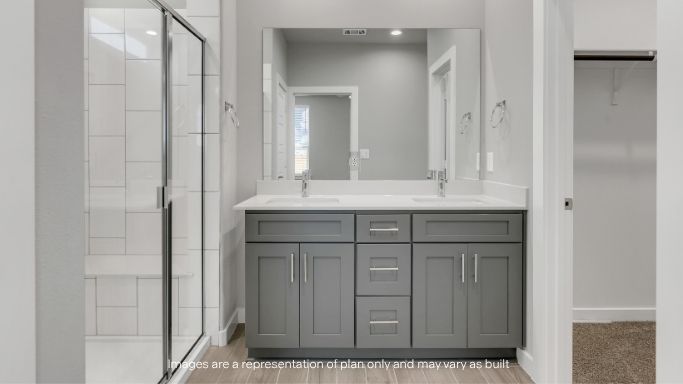 Primary bathroom with luxurious shower and built in storage