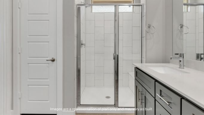 Primary bathroom with luxurious shower and built in storage