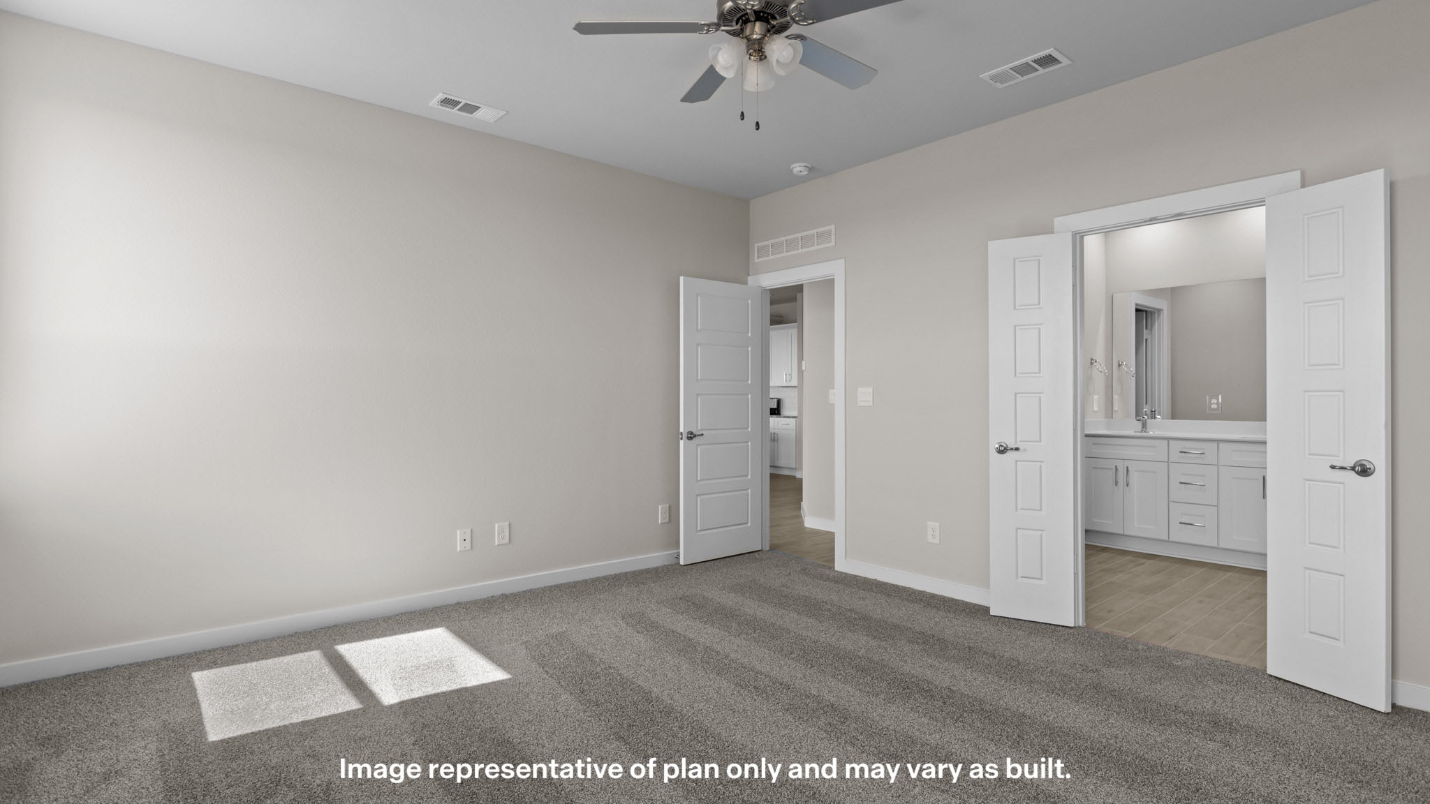 Primary bedroom with private attached bathroom and walk-in closet