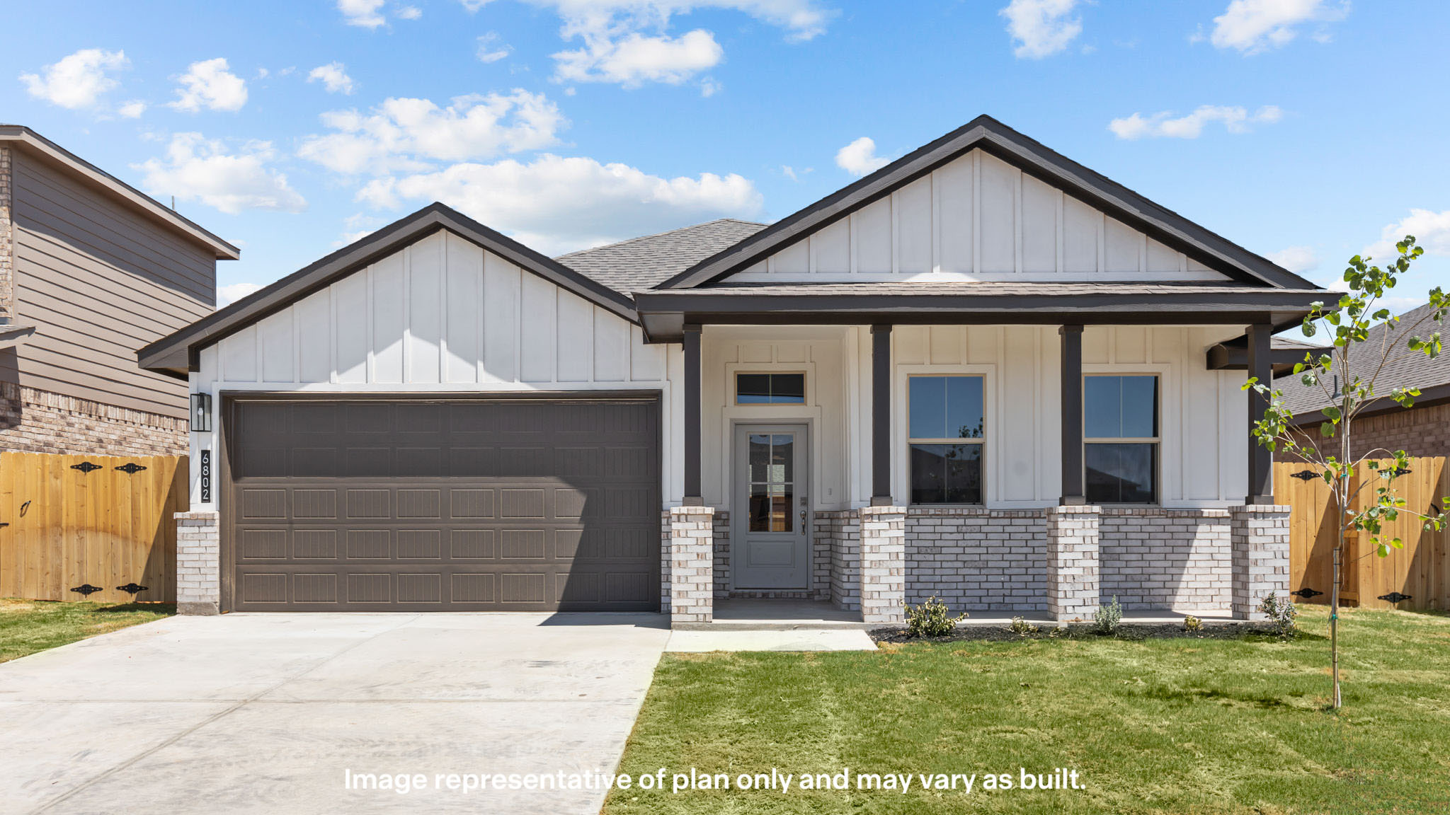 Exterior of single story modern farmhouse home