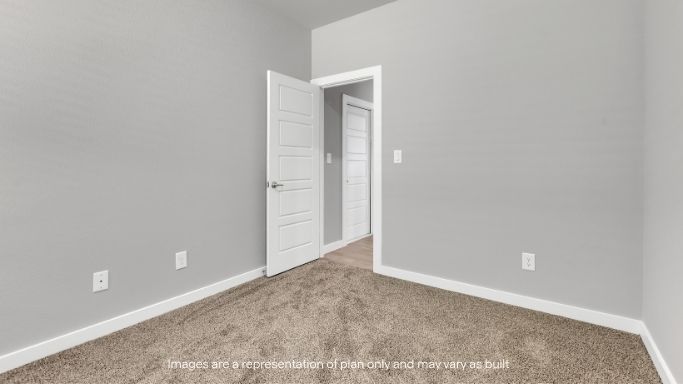 Cozy secondary bedroom with neutral tones.