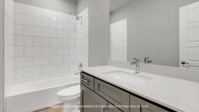 Full bathroom with tub/shower combo and modern vanity.