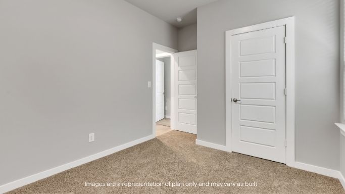 Guest bedroom 3 with plush carpet floors and spacious closet