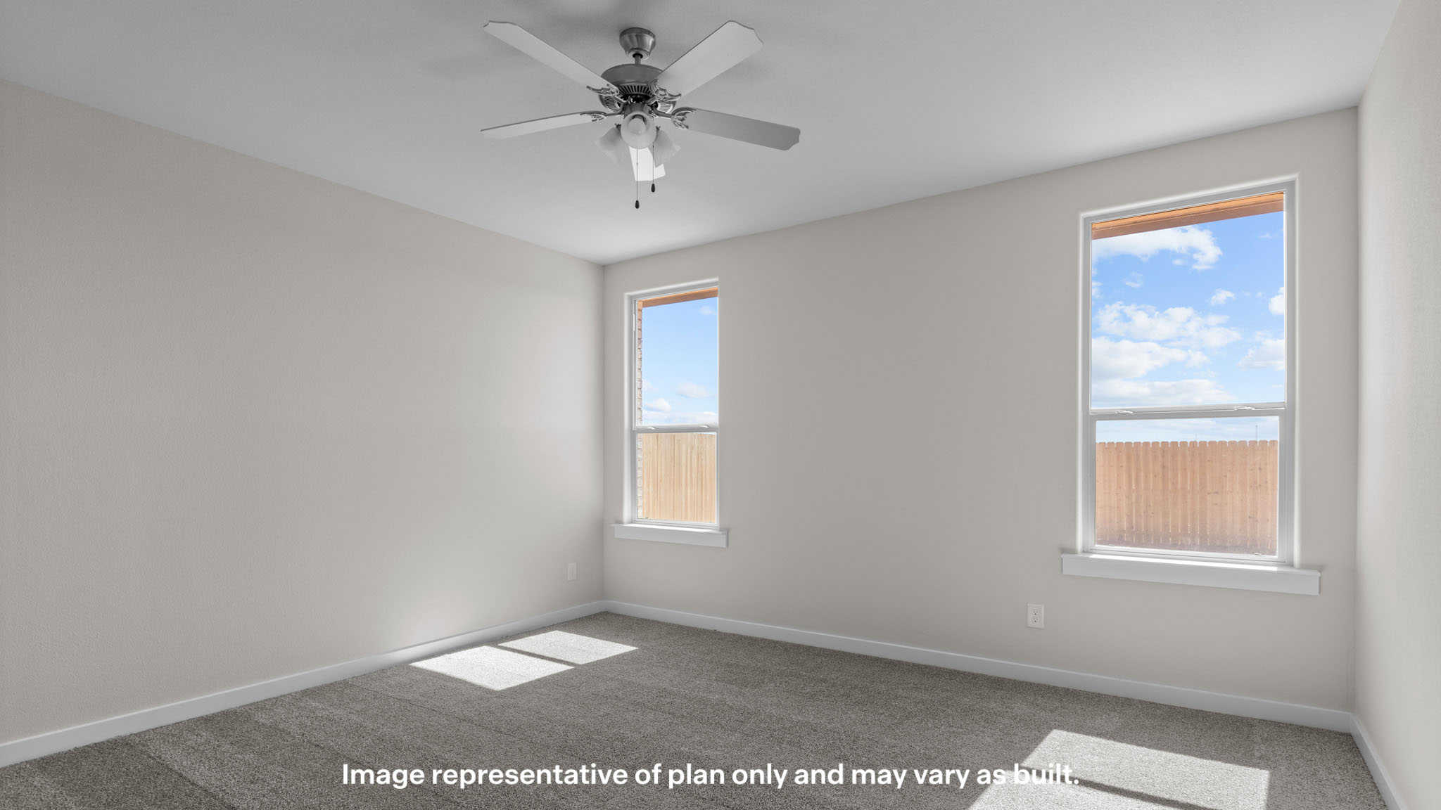 Primary bedroom with plush carpet floors and light allowing double windows