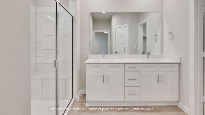 Primary bathroom with luxurious shower and built in storage