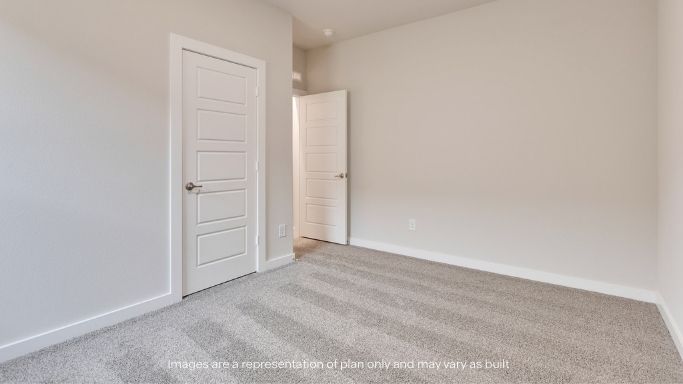 Guest bedroom 2 with side window and plush carpet floor