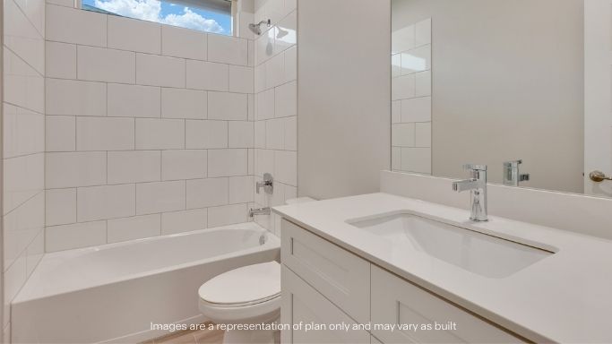 Guest bathroom with built in vanity and combination bathtub shower