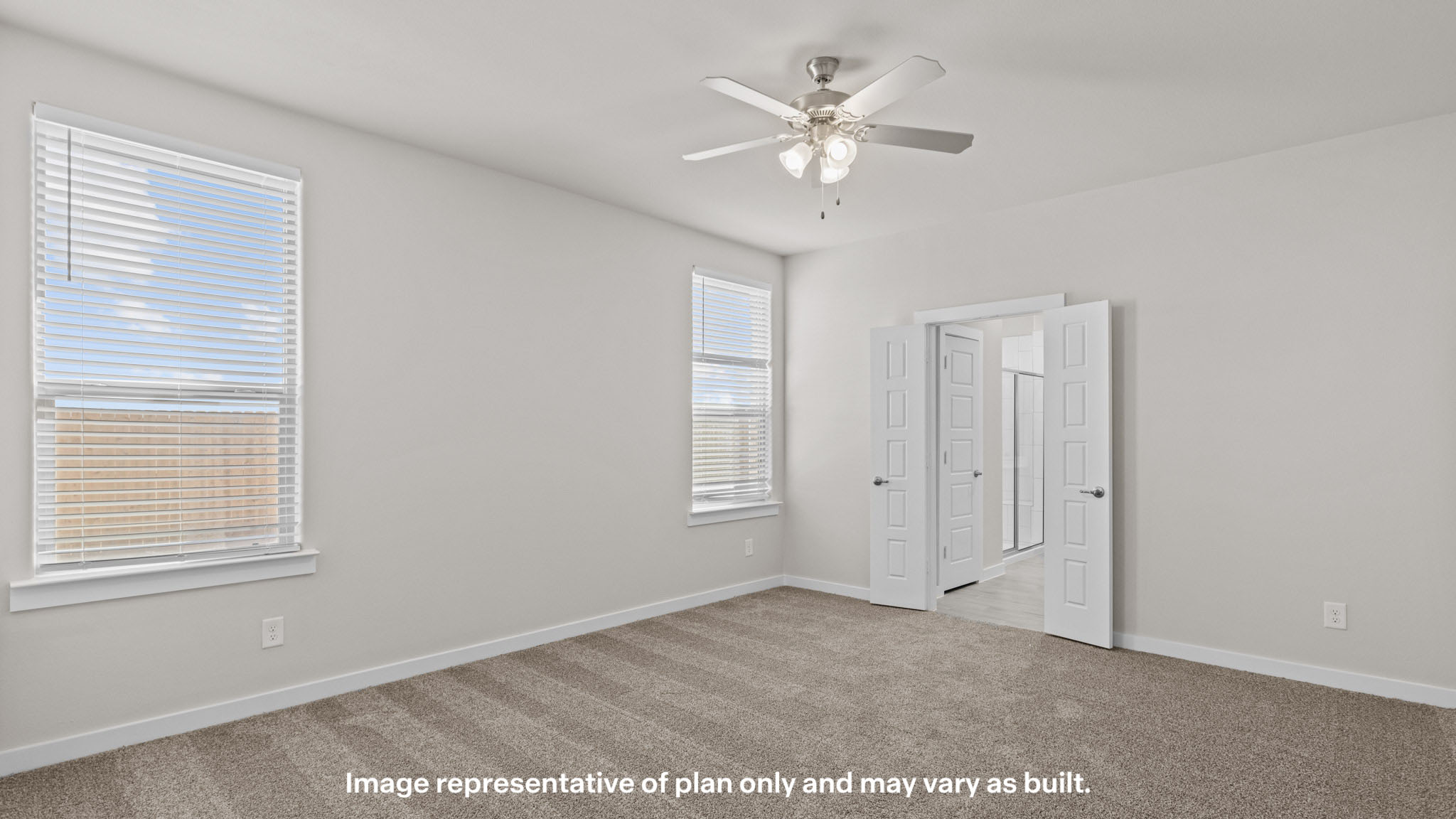 Primary bedroom with plush carpet floors and light allowing double windows
