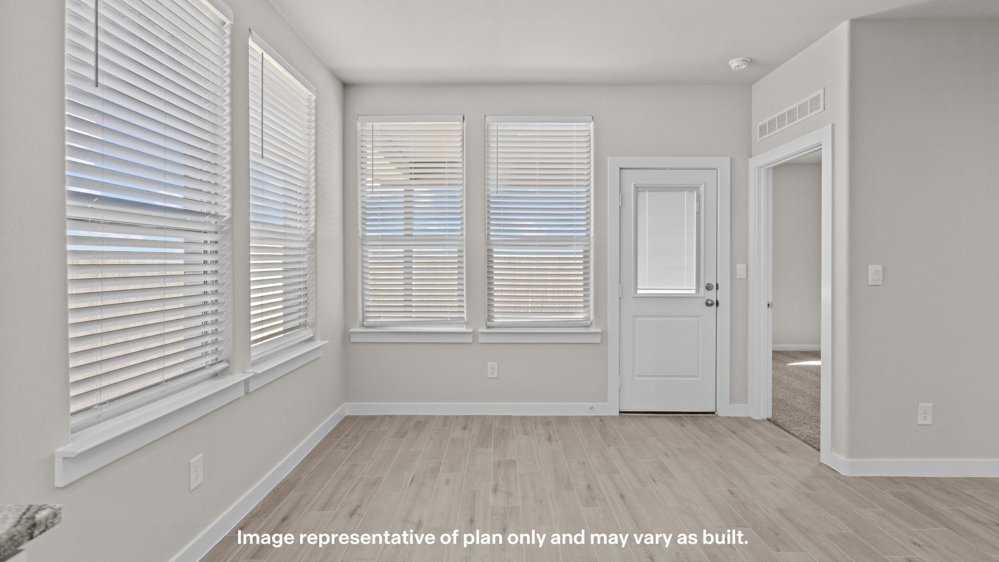 Open living and family room area with ample natural light