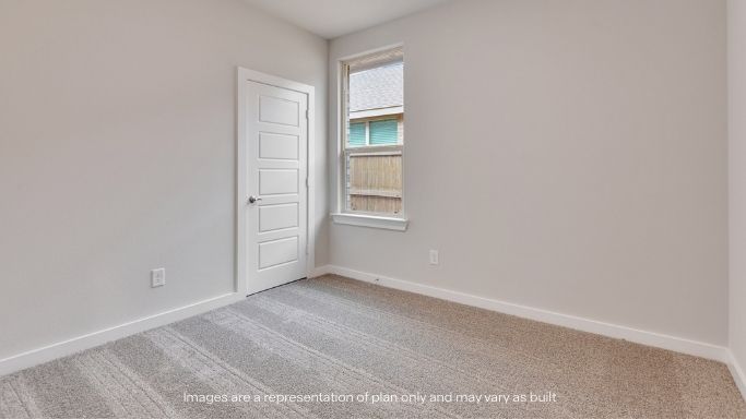 Guest bedroom 1 with front windows and ample natural light