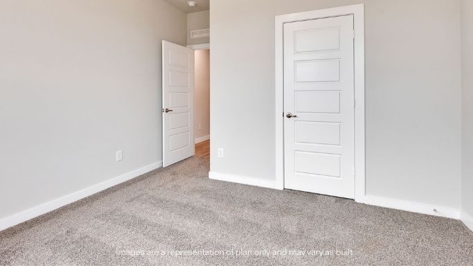 Guest bedroom 3 with plush carpet floors and spacious closet