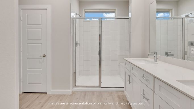 Private attached primary bathroom with built in vanity