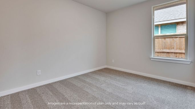 Guest bedroom 2 with side window and plush carpet floor
