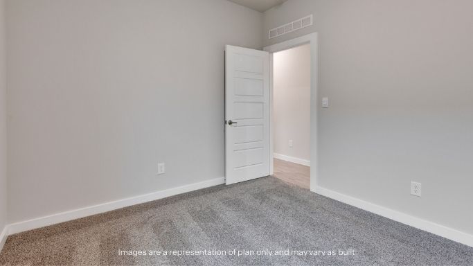 Guest bedroom 3 with plush carpet floors and spacious closet