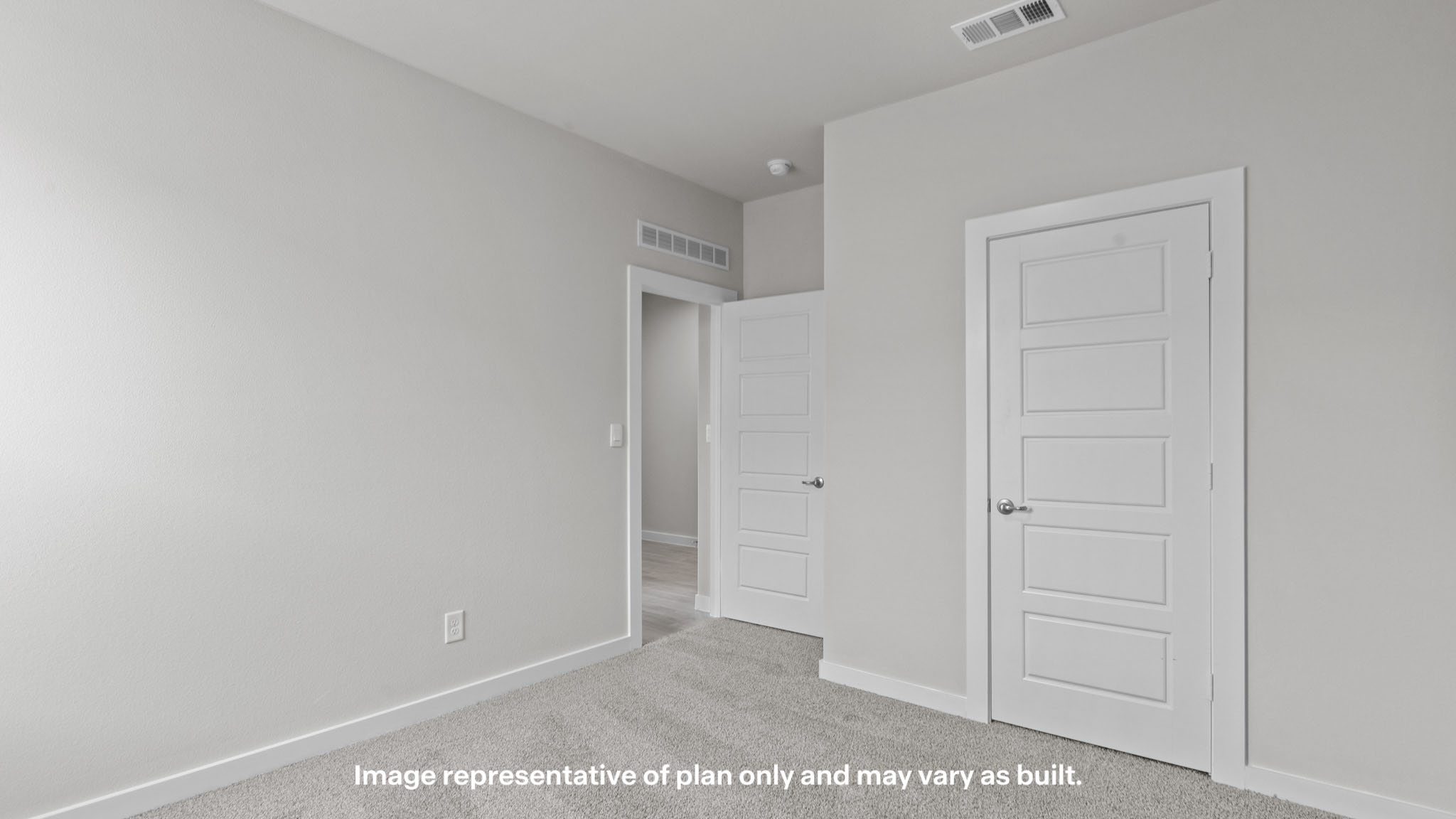 Guest bedroom 2 with side window and plush carpet floor