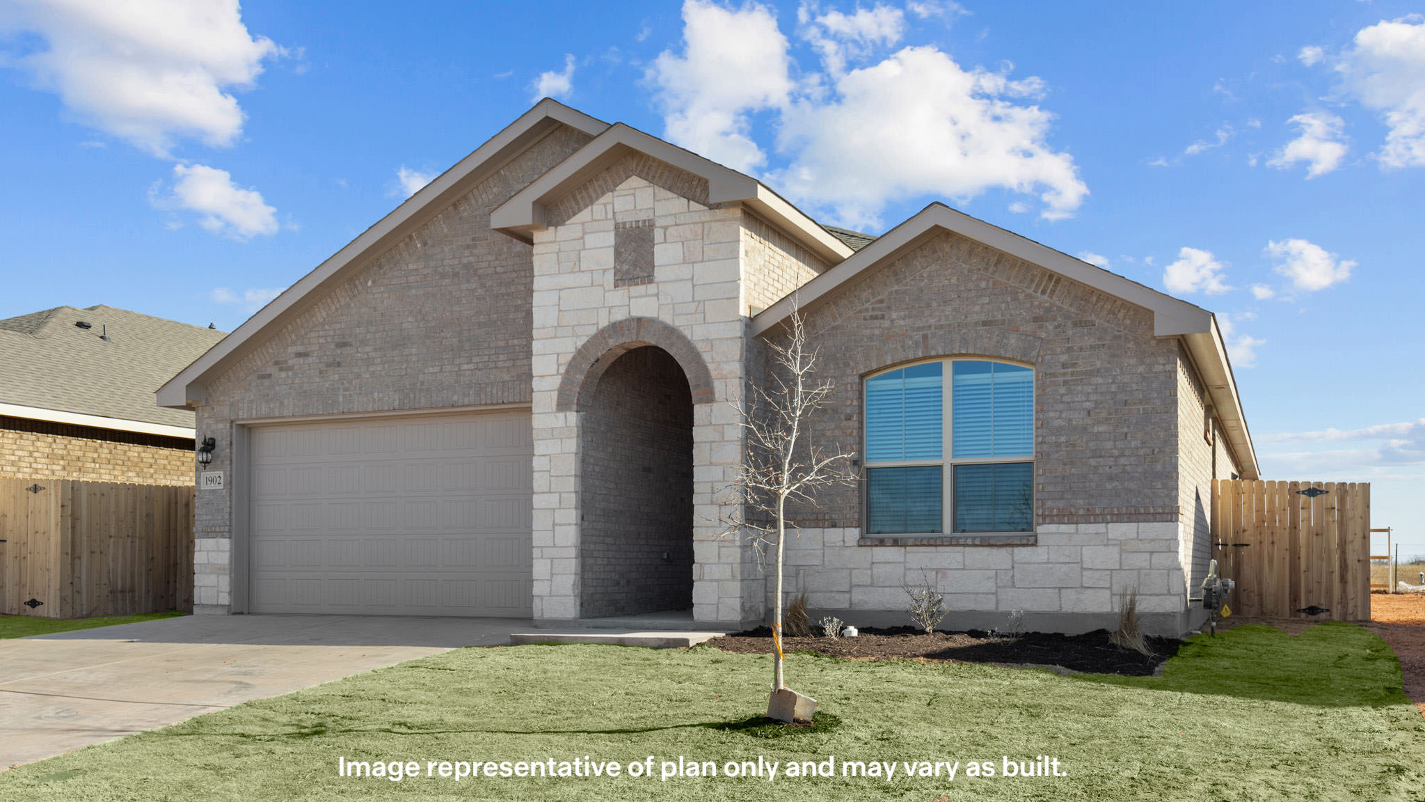 Side view of single story timeless brick home