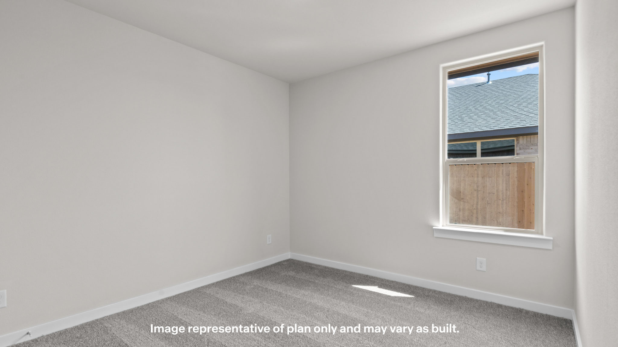 Guest bedroom 2 with side window and plush carpet floor
