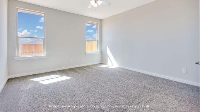 Primary bedroom with plush carpet floors and light allowing double windows