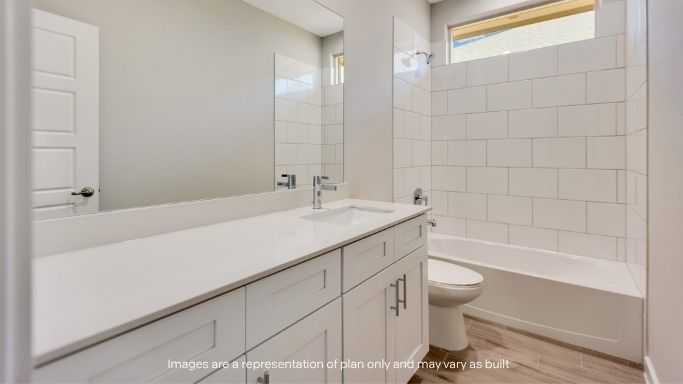 Guest bathroom with built in vanity and combination bathtub shower