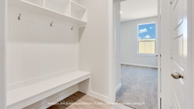 Foyer with mudroom space and additional storage