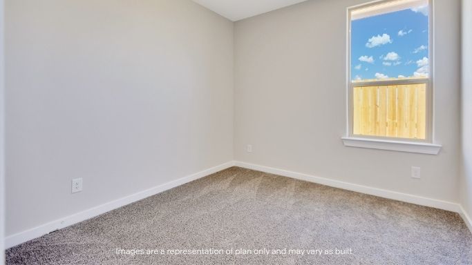 Guest bedroom 1 with front windows and ample natural light