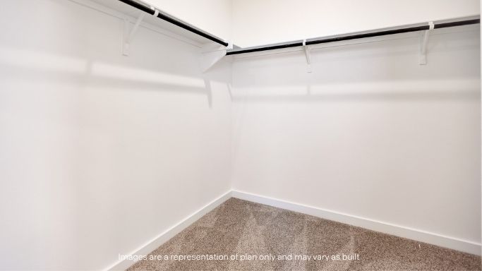 Primary walk-in closet with extra storage space