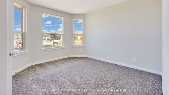 Guest bedroom 2 with side window and plush carpet floor