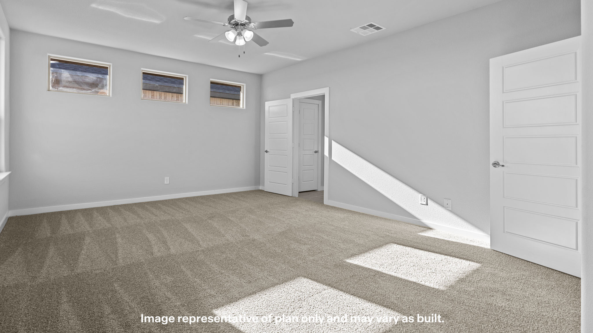 Primary bedroom with private attached bathroom and walk-in closet