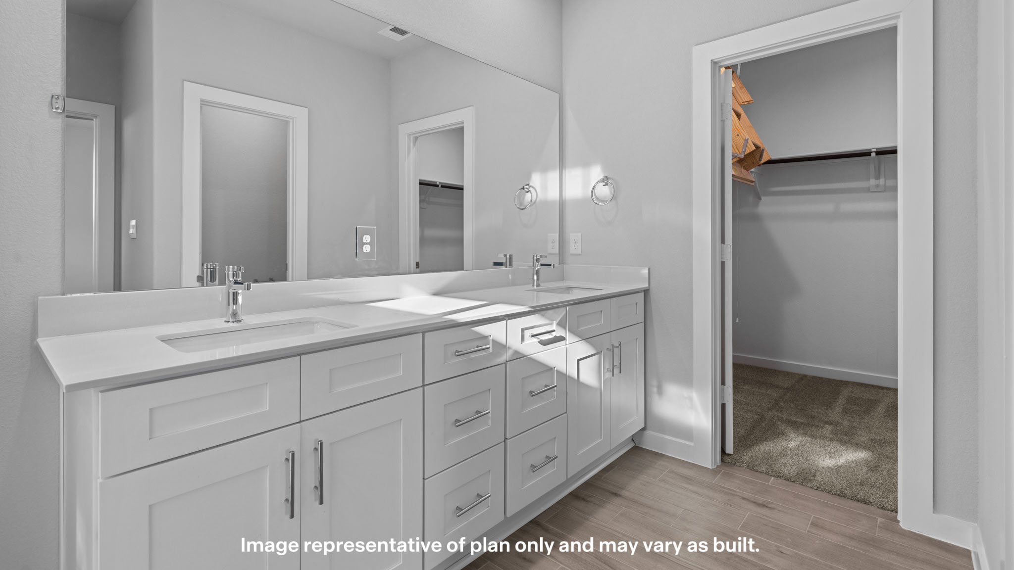 Primary bathroom with built in vanity and luxurious shower