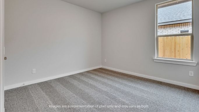 Guest bedroom 2 with side window and plush carpet floor