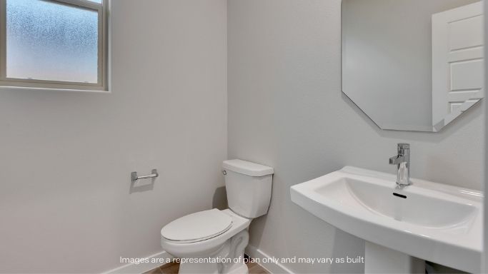 Guest bathroom with built in vanity and combination bathtub shower