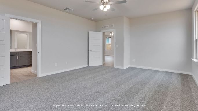 Primary bedroom with plush carpet floors and light allowing double windows