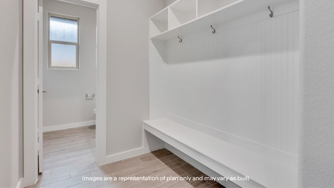 Foyer with mudroom space and additional storage
