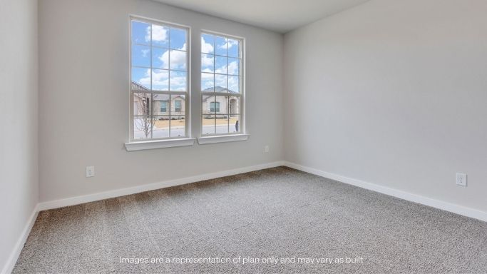 Guest bedroom 2 with side window and plush carpet floor