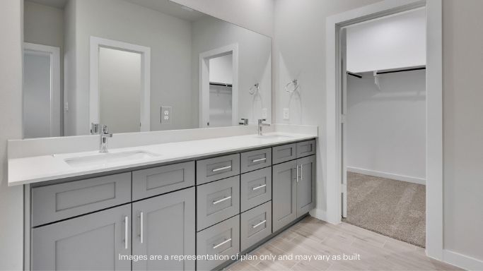 Primary bathroom with built in vanity and luxurious shower