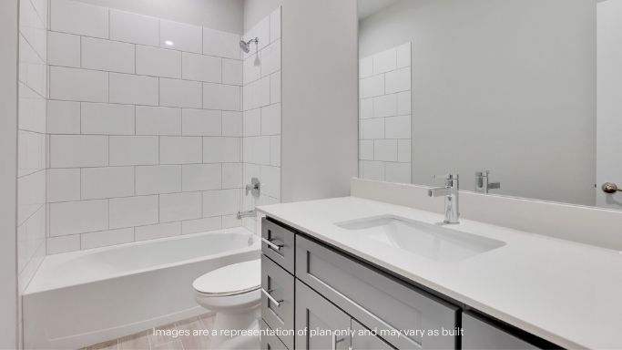 Guest bathroom with built in vanity and combination bathtub shower